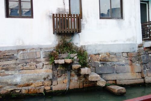 Ghost steps on the Shantang Canal.  Clearly this wall once held a door.